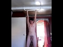 Doing pull-ups at 18 on the bar, naked with a big dick