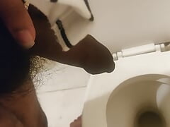 Indian black dick men peeing in the toilet
