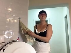 Milf with big boobs is cleaning the house