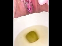 Shaved dirty pussy has longest continuous piss in toilet