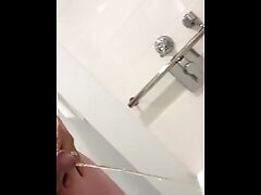 Daddy pissing yellow stream in expensive hotel bathtub