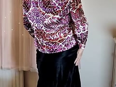 Crossdresser in satin blouse and skirt