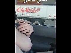 Sexy MILF Darcie Dean driving in traffic with her big tits out.